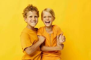 Boy and girl cuddling fashion childhood entertainment isolated background unaltered photo