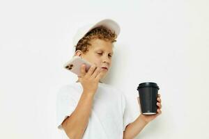 Cute little boy talking on the phone with a black glass light background unaltered photo