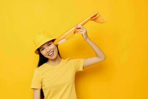 Portrait Asian beautiful young woman with a yellow plane in his hands a toy Monochrome shot photo