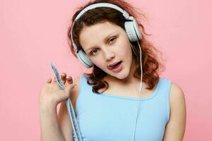 pretty woman with headphones entertainment hand gestures music fun unaltered photo