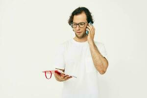 man talking on the phone red notepad isolated background photo