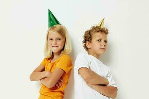 Small children in multicolored caps birthday holiday emotion lifestyle unaltered photo