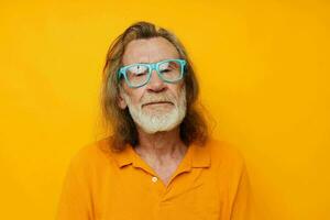 old man wearing blue glasses yellow tshirt photo