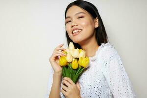 woman romance bouquet of flowers near the face studio model unaltered photo