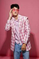 portrait of a young man plaid blazer pink glasses fashion modern style isolated background unaltered photo