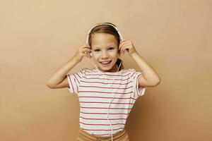 Portrait of happy smiling child girl headphones entertainment emotions Lifestyle unaltered photo