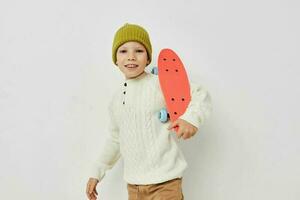 Portrait of happy smiling child girl stylish clothes skateboard Lifestyle unaltered photo