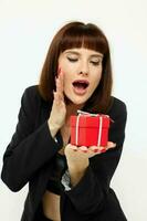 attractive woman posing with red gift box surprise light background photo