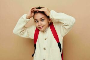 cute girl schoolgirl with red backpack posing childhood unaltered photo