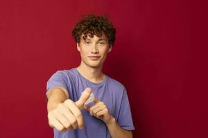 A young man medical mask protection posing red background unaltered photo