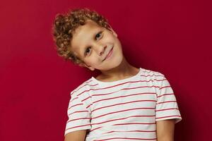 little boy in striped t-shirt gesture hands emotions posing photo