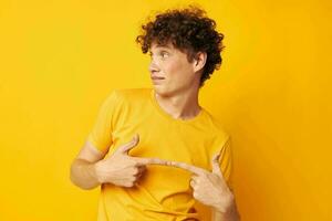 cute red-haired guy wearing stylish yellow t-shirt posing isolated background unaltered photo