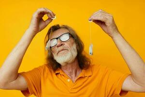 elderly man wearing a yellow t-shirt Tea bags photo