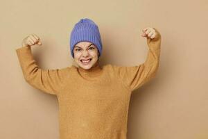 little girl in caps and sweaters posing photo