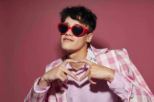 Photo of romantic young boyfriend sunglasses pink blazer fashion elegant style pink background unaltered