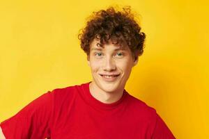 guy with red curly hair red t shirt fun posing casual wear isolated background unaltered photo