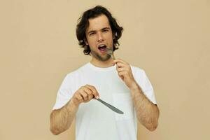 Attractive man cutlery in hand posing Lifestyle unaltered photo