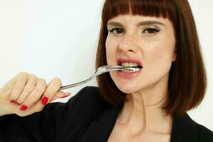 attractive woman knife and fork in hands emotions posing Lifestyle unaltered photo