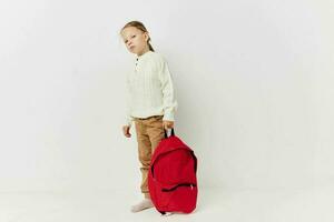 cute girl school backpack with a hat on his head Lifestyle unaltered photo