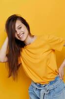 optimistic young woman fashion in yellow t-shirt denim shorts Lifestyle unaltered photo