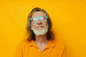 old man wearing blue glasses yellow tshirt photo