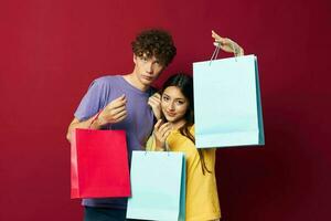 cute young couple colorful bags shopping fun Lifestyle unaltered photo