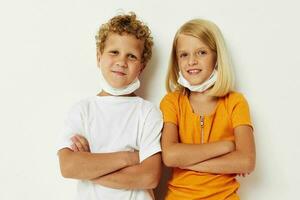 cheerful children in medical mask protection posing grimace lifestyle unaltered photo