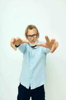 Portrait of happy senior man in shirt and glasses posing emotions isolated background photo