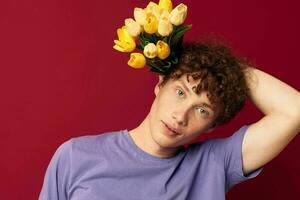 young guy red hair in casual wear bouquet of flowers gift isolated background unaltered photo