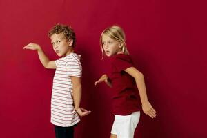 cheerful children smiling and posing in casual clothes against isolated background unaltered photo