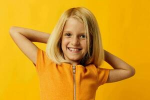 Young blonde girl blonde straight hair posing smile fun childhood lifestyle unaltered photo