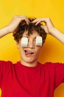 guy with red curly hair posing emotions tea bags yellow background unaltered photo