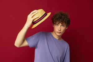 A young man red hair in casual wear Youth Style Studio red background unaltered photo