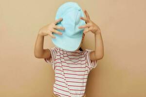 little girl in blue caps striped t-shirt emotions Lifestyle unaltered photo