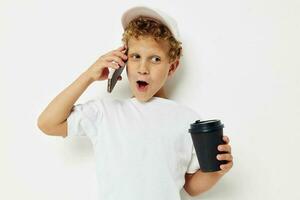 cute boy what kind of drink is the phone in hand communication light background unaltered photo