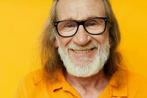 cheerful elderly man with glasses gray beard close-up photo