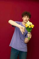 kinky guy red hair in casual wear bouquet of flowers gift red background unaltered photo