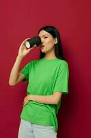 pretty brunette smile green t-shirt black disposable cups fashion studio model unaltered photo