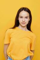 beautiful girl in a yellow t-shirt emotions summer style yellow background photo