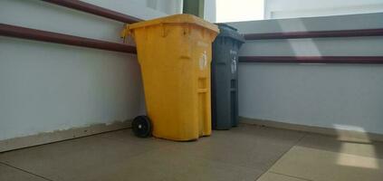 Object photography - 2 pieces Gray and yellow trash cans photo