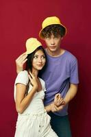 nice guy and girl in colorful t-shirts stylish clothes hats isolated background photo