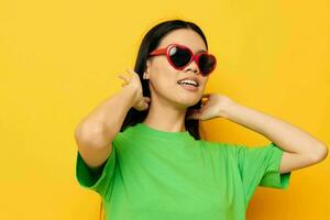 woman with Asian appearance sunglasses fun posing casual isolated background unaltered photo