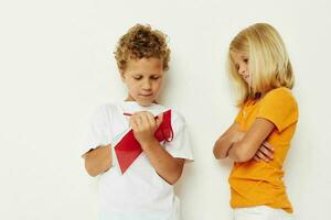 picture of positive boy and girl draw in the notebook childhood entertainment lifestyle unaltered photo