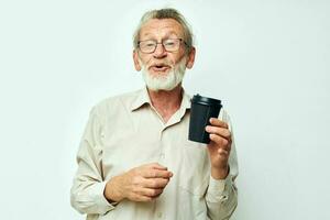 elderly man in a shirt and glasses a black glass light background photo