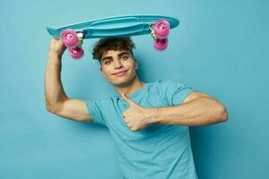 Attractive man sport skateboard posing isolated background photo