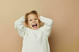 pretty young girl childrens style emotions fun isolated background photo