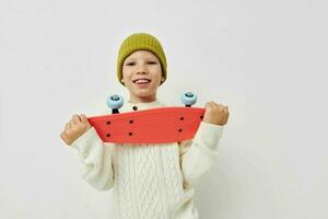 Portrait of happy smiling child girl stylish clothes skateboard Lifestyle unaltered photo