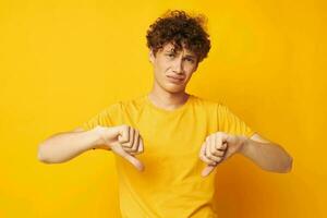 Young curly-haired man Youth style studio casual wear isolated background unaltered photo