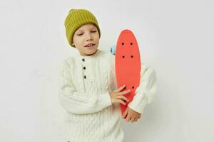 cute girl in hats with a skateboard in their hands Lifestyle unaltered photo