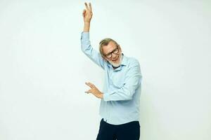 Portrait elderly man in shirt and glasses posing emotions isolated background photo